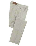 The folded pair of Johnnie-O Atlas 5-Pocket Pants is made from garment-dyed stretch twill in light gray, featuring front and back pockets along with a brown leather patch on the waistband. These lightweight pants are ideal for casual days and vacation wear.