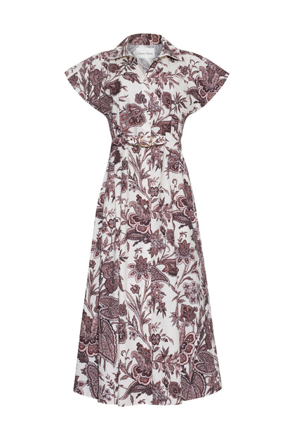 The Sawyer Dress by Cara Cara showcases a timeless shirtdress silhouette with short sleeves, a collared neckline, front button closure, and a belted waist. Its all-over maroon floral and paisley print brings an elegant touch to this effortlessly chic poplin A-line dress.