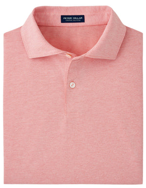 A folded pink Albatross polo shirt from Peter Millar, featuring a pointed collar with one white button fastened and a navy blue label displaying "Peter Millar Crown Crafted." This Peter Millar Albatross Cotton Blend Piqué Polo offers four-way stretch and moisture-wicking fabric for ultimate comfort.