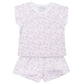 The Lila & Hayes Girls' Emery Short Set is crafted from soft Pima cotton and includes a short-sleeve shirt and shorts, both adorned with a subtle pink bear print pattern.