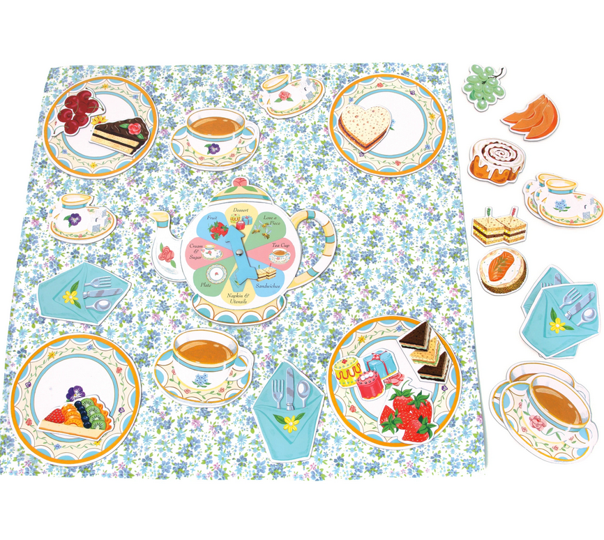 The Eeboo Tea Party Spinner Game features a floral-patterned play set with illustrated tea cups, plates, tea-time treats, and a teapot spinner on a blue and white fabric tablecloth.