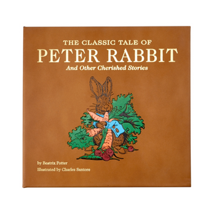 Product cover for "The Classic Tale Of Peter Rabbit, Leather Edition" by Graphic Image, featuring an illustration of Peter Rabbit amidst vegetables with original illustrations by Charles Santore.