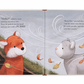 Children's book illustration showing a red fox and a gray cat outside in a windy scene with falling leaves. Text reads, "Hello?" called a voice. "Rusty Fox," purred the cat, "Can we come into the warm?" This giftable hardback, Jellycat Warm in the Storm Book by Jellycat, makes for a perfect bedtime story.