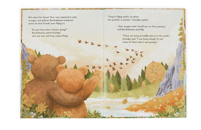 Two illustrated bears, Bartholomew Bear and a smaller cub, wave to a flock of birds flying south over an autumn forest scene. Text on the pages discusses the birds' migration and Grandpa's past experiences in "Jellycat It's a Big World Bartholomew Book" by Jellycat.