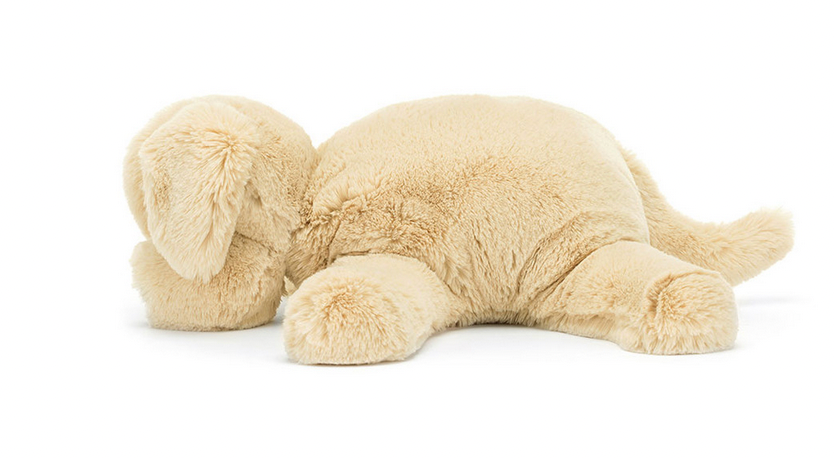 A Jellycat Wanderlust from Jellycat resembling a beige dog lying flat with its head turned to the side and all four legs spread out, perfect for any wanderlust elly seeking a chilled softie companion.