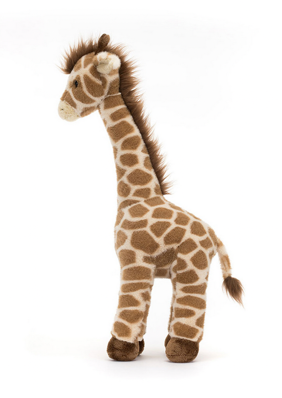 The Jellycat Dara Giraffe, a soft toy with a light brown body, dark brown spots, and a dark brown mane, stands proudly on four legs against a white background. This charming stuffed giraffe makes an adorable nursery mascot.