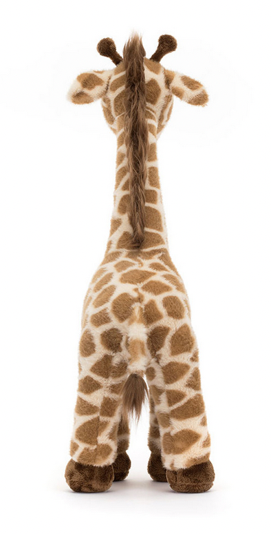 A Jellycat Dara Giraffe viewed from behind, displaying its long neck, brown and white spotted pattern, and brown hooves—the perfect nursery mascot for a Scrumptiously soft playtime safari.