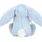 A Jellycat Bashful Blue Bunny Soother viewed from the back, featuring long floppy ears and a small white tail, makes an ideal newborn gift crafted from recycled fibers.