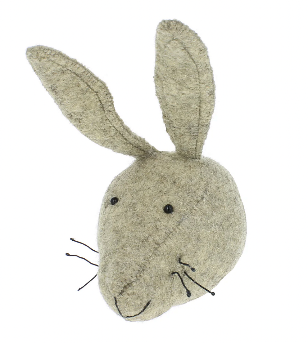 The Fiona Walker Hare Head Wall Decoration - Mini is a handcrafted piece featuring large ears and simple facial features, made from organic wool in a sophisticated grey color.