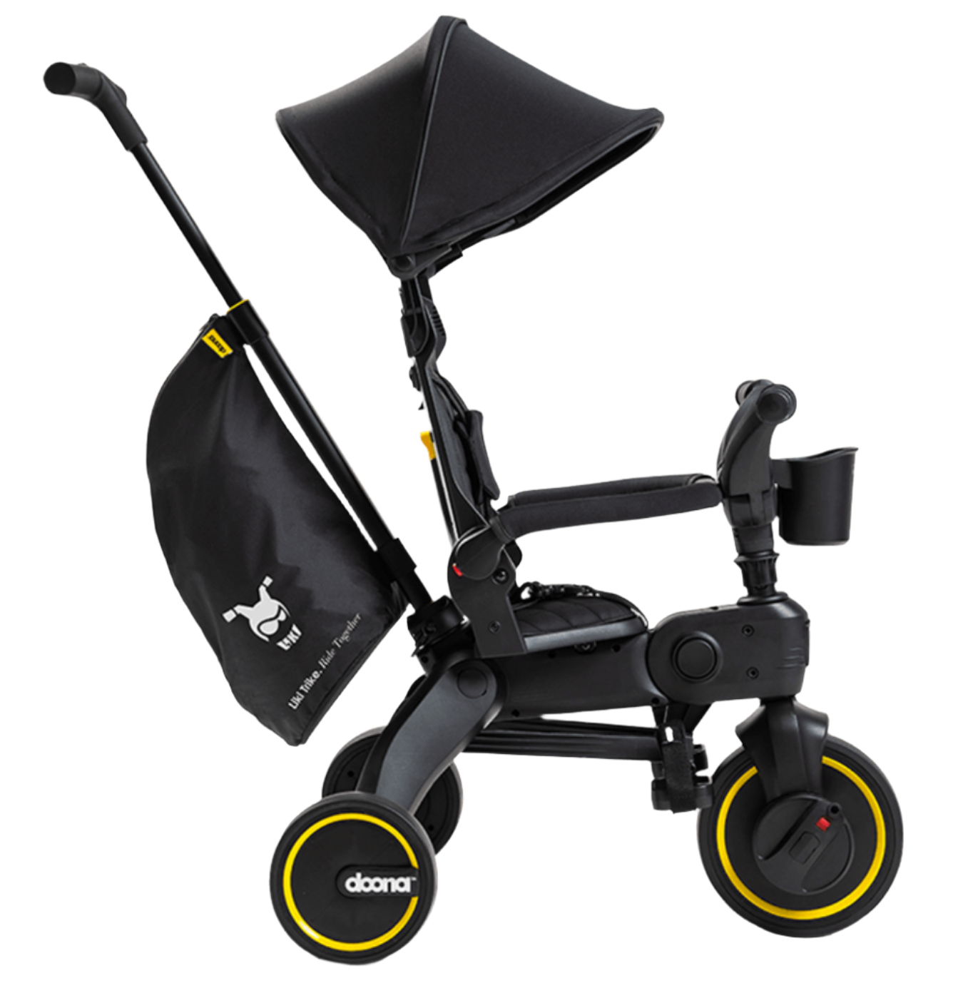 The DOONA Liki Trike - Midnight Edition by Doona is a black tricycle stroller with yellow accents that includes a cup holder, sun canopy, and a storage bag attached to the handle. This compact folding trike is the ideal stroller alternative for active parents.