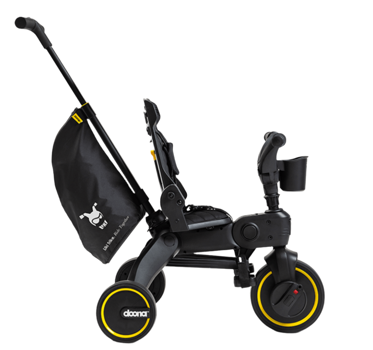 Side view of the DOONA Liki Trike - Midnight Edition by Doona, featuring a black and yellow color scheme with a black storage bag attached to the handlebar and a cup holder at the front. This compact folding trike design is an ideal stroller alternative.