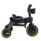 The DOONA Liki Trike - Midnight Edition is a black tricycle featuring a handlebar, seat, yellow-rimmed wheels, and a cup holder attachment. The brand name "Doona" is prominently displayed on the front wheel. This 5 in 1 compact folding trike serves as an excellent stroller alternative.