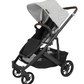 The UPPAbaby Cruz V2 Stroller by UPPAbaby features a modern design with a sleek black frame, four wheels, and a black toddler seat complemented by a light gray canopy. It includes an adjustable brown handlebar and a convenient storage basket underneath.