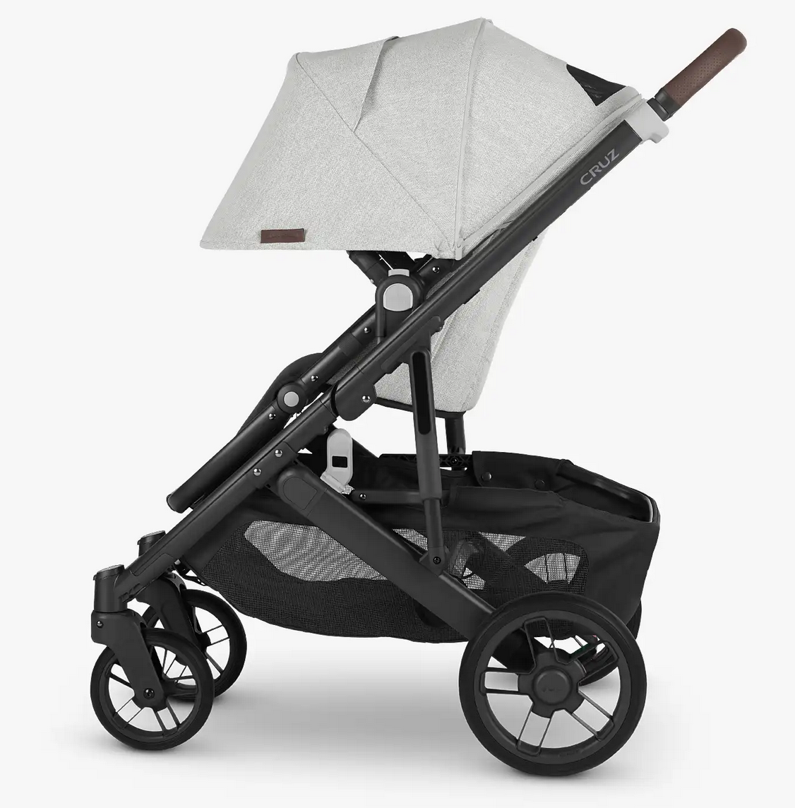 Side view of a black and gray UPPAbaby Cruz V2 Stroller with four wheels, a canopy, and an under-seat storage basket. The brand name "UPPAbaby" is visible on the side. It features an adjustable handlebar for added convenience.