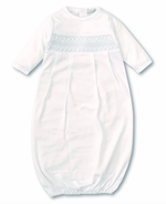 The Kissy Kissy Sack Gown with Hand Smocked, by Kissy Kissy, is a white baby gown with long sleeves made from soft Peruvian cotton. It features a hand-smocked panel across the chest and an elastic hem at the bottom.