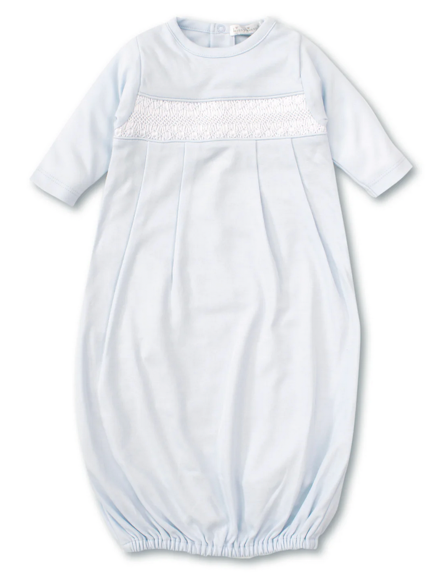 The Kissy Kissy Sack Gown with Hand Smocked, by Kissy Kissy, is a light blue infant sleep gown made from soft Peruvian Pima cotton. It features long sleeves, smocked chest detailing, and a gathered elastic hem.