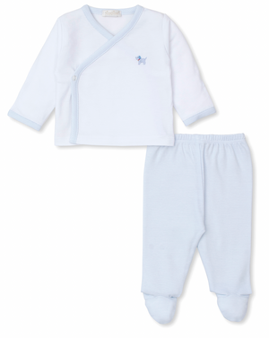 The Kissy Kissy Premier Hand Embroidered Puppies Footed Pant Set by Kissy Kissy is a white Pima cotton baby outfit with light blue trim. It includes a long-sleeved top with small dog embroidery and matching footed pants.