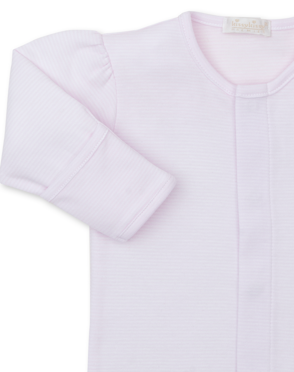 Close-up of a light pink, long-sleeve Kissy Kissy Premier Hand Embroidered Puppies Striped Footie, crafted from soft Pima cotton, showing the fabric texture and a label near the neckline.