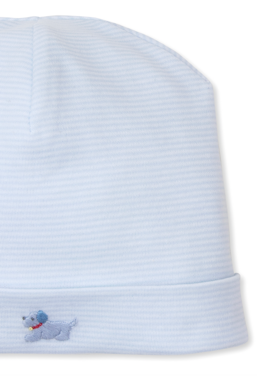 The Kissy Kissy Premier Puppies Hand Embroidered Striped Hat, by Kissy Kissy, is an adorable light blue striped baby hat made from soft Pima cotton. It features a charming hand-embroidered blue puppy on the front to keep your little one's head warm and stylish.