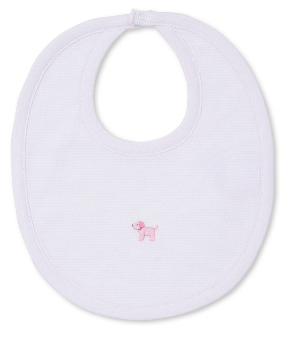 The Kissy Kissy Premier Puppies Hand Emb Bib Pink by Kissy Kissy is a white Pima cotton baby bib with an embroidered pink puppy in the center.