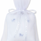 The Kissy Kissy Hand Embroidered Premier Puppies Musical Pillow with Tulle Bag in White/Light Blue includes a small pillow featuring blue hand-embroidered poodle designs, making it perfect for puppy friends. This delightful item is elegantly presented in a white sheer tulle gift bag with a ribbon tie.