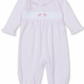 The Kissy Kissy Premier Hand Embroidered Puppies Playsuit by Kissy Kissy is a light pink long-sleeved baby romper made from Pima cotton, featuring a ruffled collar and cuffs with hand-embroidered pink poodles on the chest.