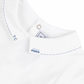 Close-up image of the Tartine et Chocolat Collared Short-Sleeved Onesie with blue stitching details on the pointed collar and a small van embroidery below the button, perfect for special occasions.