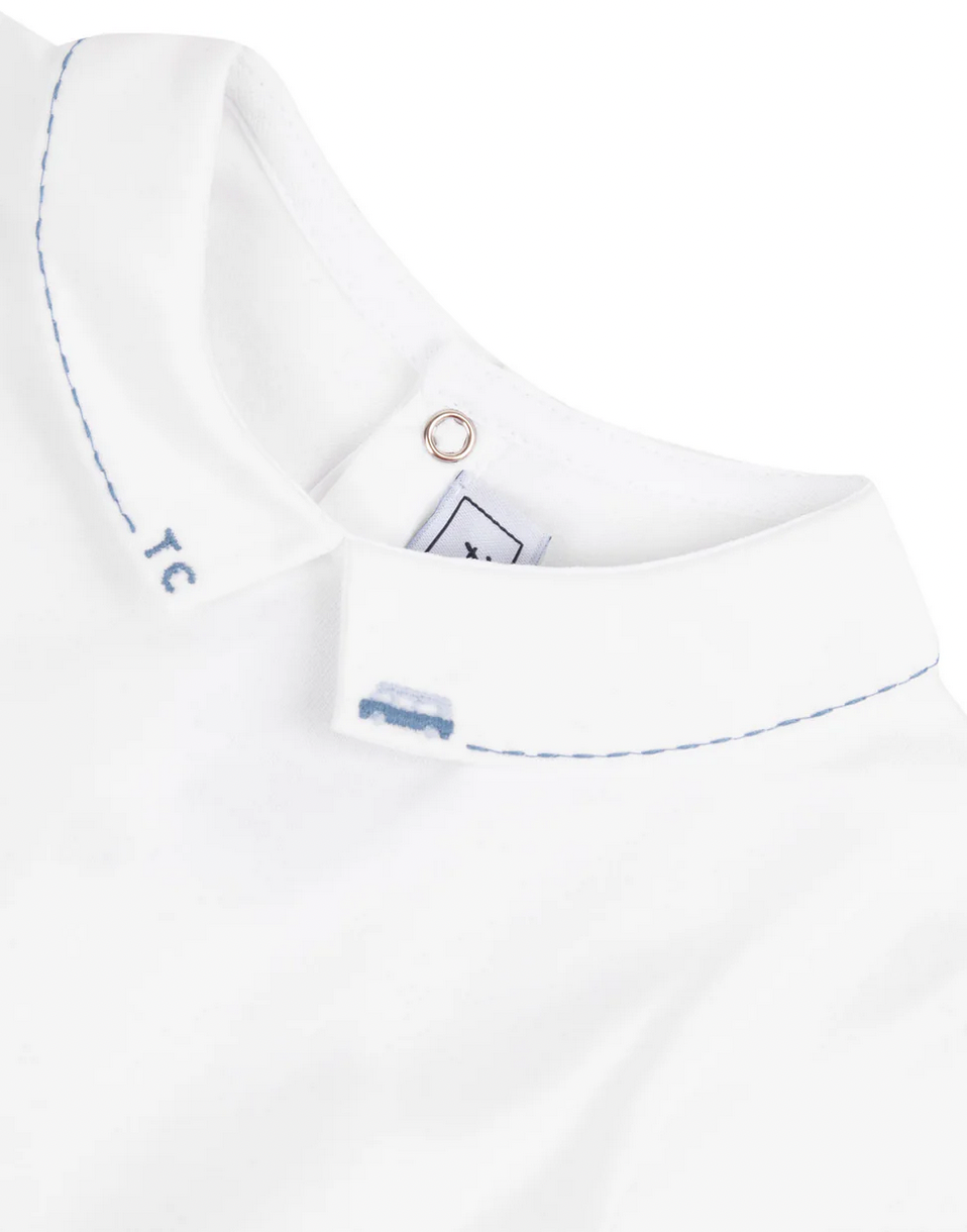 Close-up image of the Tartine et Chocolat Collared Short-Sleeved Onesie with blue stitching details on the pointed collar and a small van embroidery below the button, perfect for special occasions.