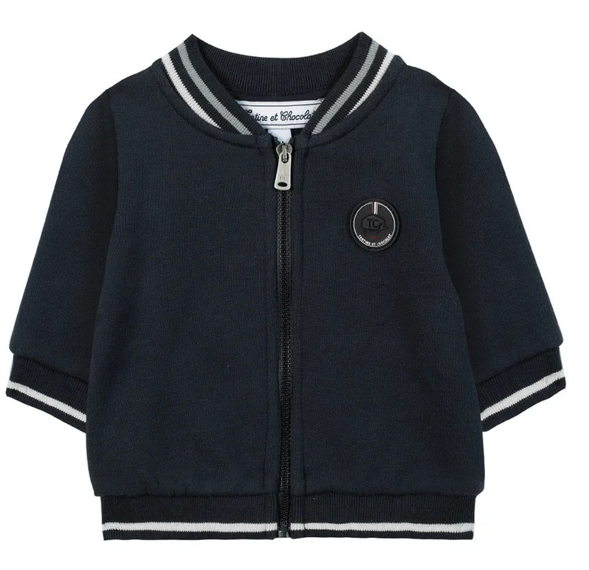 The Tartine et Chocolat Outfit Jogging Suit by Tartine et Chocolat includes a navy blue toddler jacket with white and gray striped cuffs and collar, featuring a front zipper and a circular logo on the left chest, making it perfect for pairing with a baby boy's jogging suit.