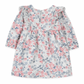 The Tartine et Chocolat Rasberry Printed Flowery Dress by Tartine et Chocolat is perfect for winter outfits. This long-sleeved piece features pink and blue flowers on a white background, ruffled shoulders, and a back zipper closure. Made with quality fabric, it ensures both style and comfort for your baby girl.