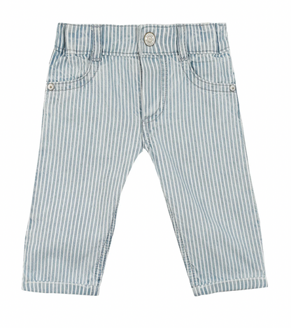 The Tartine et Chocolat Sky Blue Striped Trousers for baby boys feature a charming blue and white vertical stripe pattern, front pockets, a button, and a zipper fly, all crafted from soft and comfortable fabric.