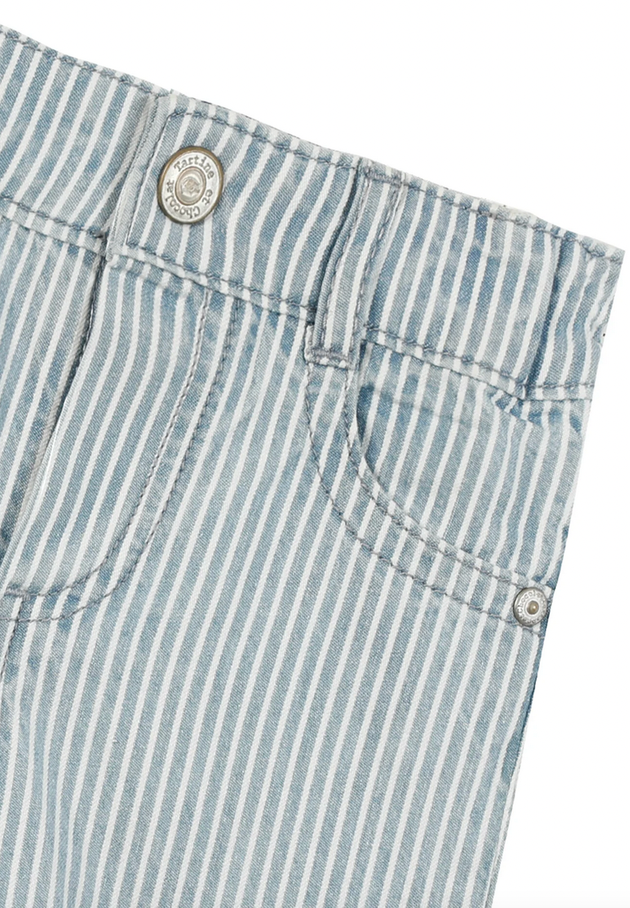 Close-up of the upper part of Tartine et Chocolat Sky Blue Striped Trousers by Tartine et Chocolat, featuring a front pocket, belt loops, and a button closure with visible stitching details—perfect trousers for a baby boy in adorable outfits made from soft and comfortable fabric.