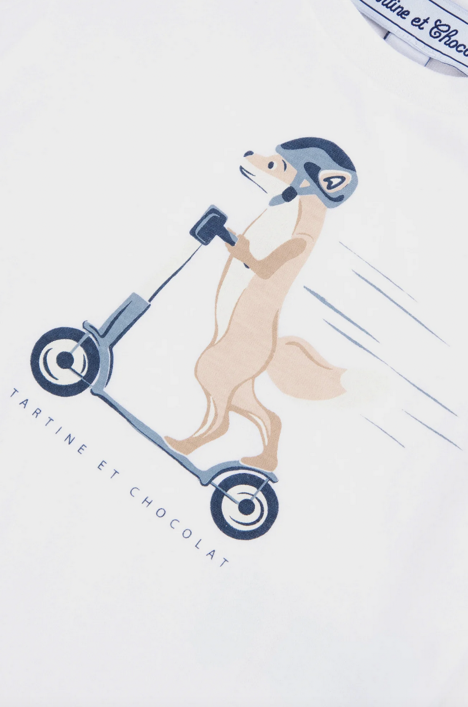 A cartoon illustration of a fox wearing a helmet while riding a kick scooter, printed on comfortable fabric with the text "Tartine et Chocolat" below. Perfect for a baby boy T-shirt!