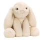 The Jellycat Smudge Rabbit Medium is a cream-colored plush with long floppy ears, round paws, and a pink nose, sitting upright—an adorable baby gift that faces forward.