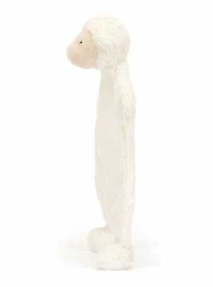 Side view of a white plush toy with a round body and a cream-colored face, standing upright. Perfect as a newborn gift, this Jellycat Bashful Lamb Comforter is not only adorable but also made from recycled fibers.