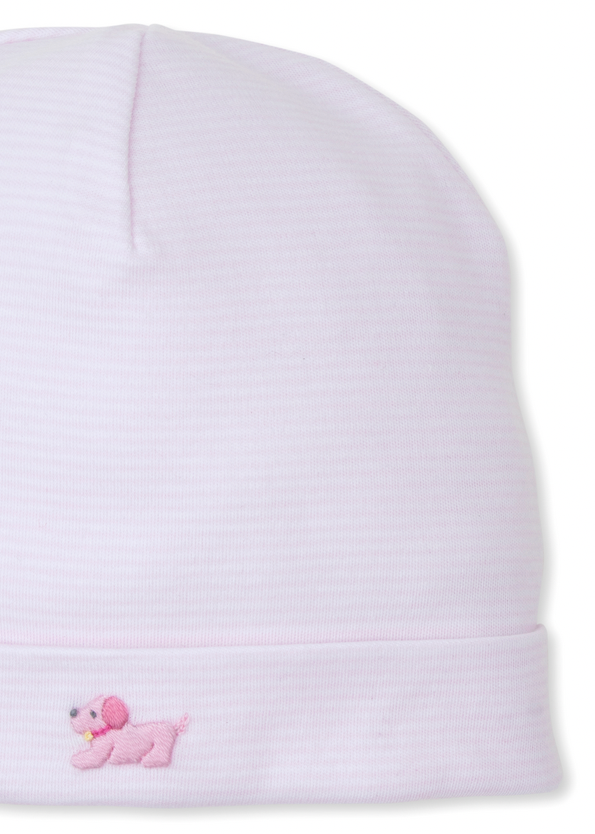 The Kissy Kissy Premier Puppies Hand Embroidered Striped Hat by Kissy Kissy is a light pink beanie made from soft Pima cotton, adorned with a small, hand-embroidered pink dog on the fold-over brim.