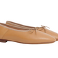 A pair of Mansur Gavriel Dream Ballerina with a small bow on top, crafted from luxurious Italian lambskin leather.