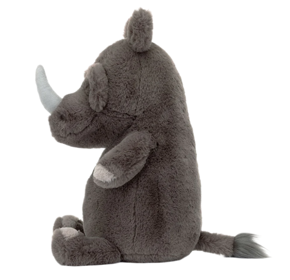 Meet Jellycat Roderick Rhinoceros, a sturdy plush toy with grey fur and a white horn, sitting upright on a white background.