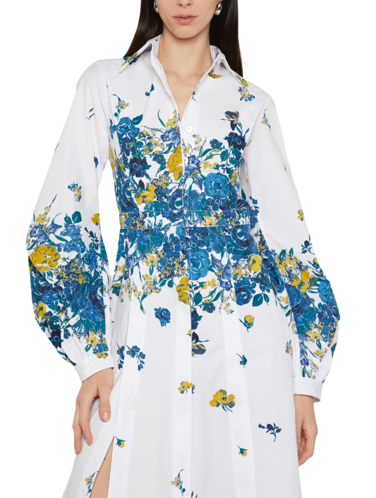 A person wearing a Prabal Gurung Long Sleeve Band Collar Shirtdress with a blue and yellow pattern, featuring long sleeves, a slit in the skirt, and a midi length, is shown from the shoulders to mid-thigh.