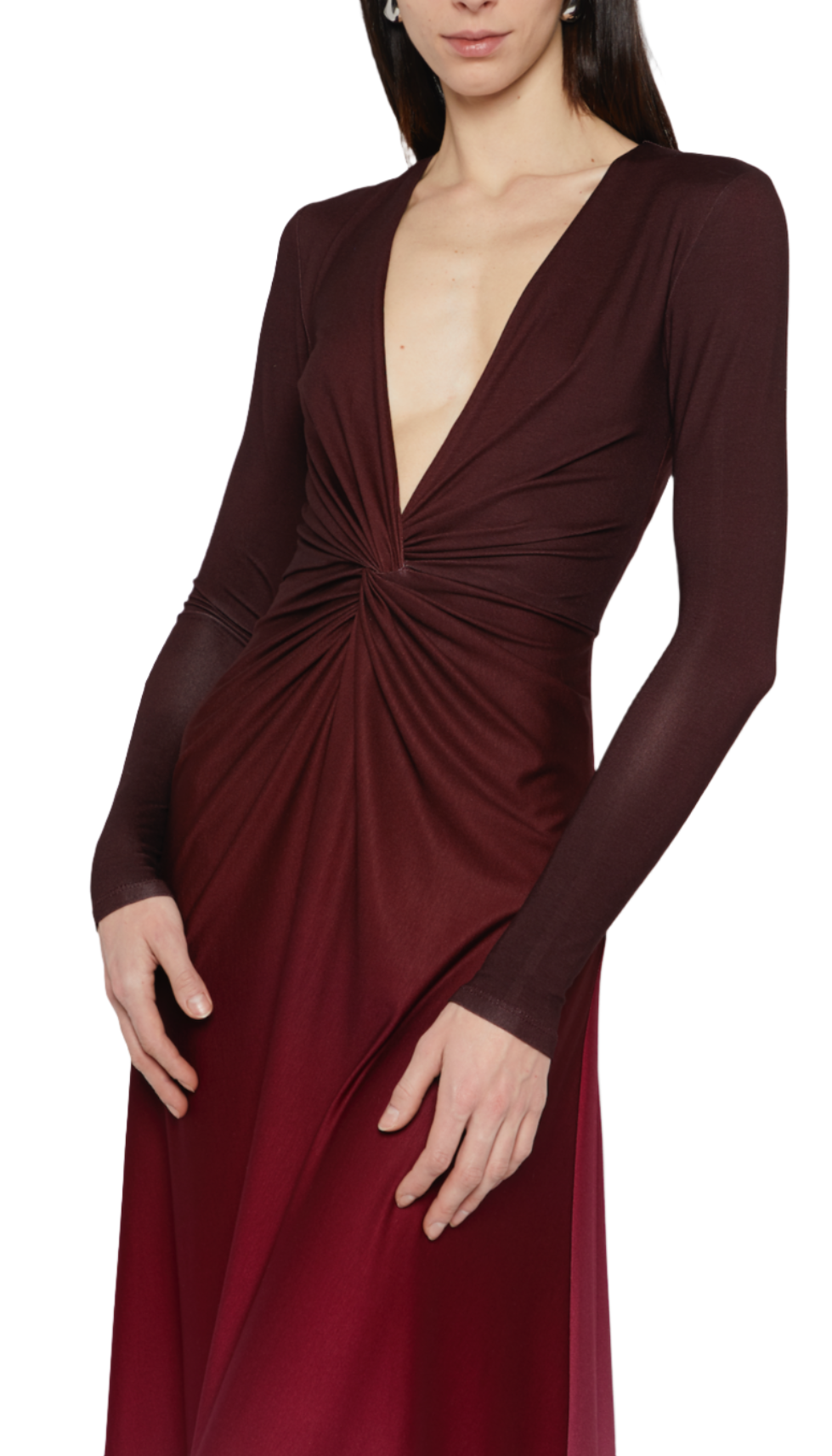 A person wearing a Prabal Gurung Twist Front Long Sleeve Dress, featuring a plunging V-neck and a twisted knot detail at the waist, adorned with an ombre design from dark red to burgundy.