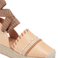 Close-up of a tan Ulla Johnson Concha Platform Espadrille with woven leather and fabric details on the upper section, featuring a beige jute platform.