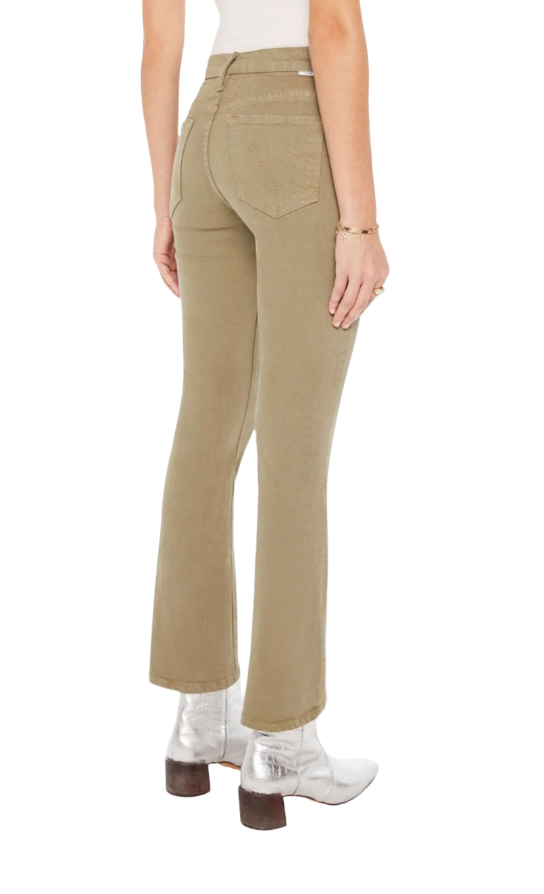 A person wearing Mother Denim Insider Hover pants by Mother in khaki color with a 30-inch inseam and metallic silver ankle boots. The photo is taken from the back, showing the right side of the person.