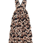 The Dephne Dress by Ulla Johnson is a sleeveless, V-neck silk taffeta maxi with tiered silhouette and an ikat-inspired black, beige, and brown abstract animal print.