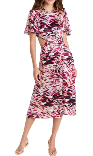 A person wearing the Prabal Gurung Flutter Slv Cut Out Dress, a 100% silk garment featuring a pink and black animal print with a cutout waist and short sleeves, stands against a white background.