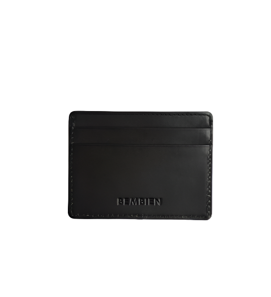 The Bembien Nico Card Case is a sleek black leather cardholder with "BEMBIEN" embossed on the front, featuring slots for cards to add a stylish touch to your essentials.