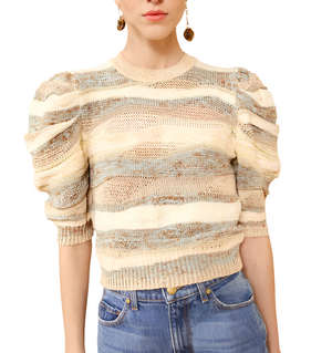 Person wearing the Ulla Johnson Odie Top paired with blue jeans, creating a chic look.