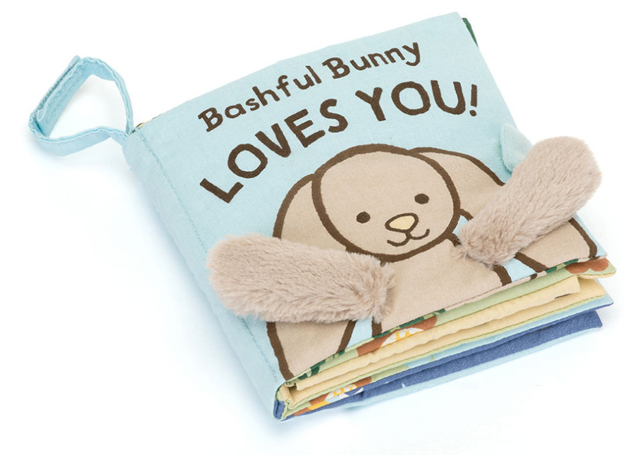 The Jellycat Bashful Bunny Loves You Book by Jellycat is a soft cloth book adorned with an illustration of a bunny with plush ears, making it ideal for baby-friendly reading.