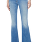 Individual wearing Mother The Weekender jeans in mid-blue wash with a mid-rise flare, paired with a white top and black heeled boots, standing against a white background.