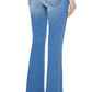 A person is shown from the back wearing Mother The Weekender mid-blue wash bootcut jeans and black heeled shoes.