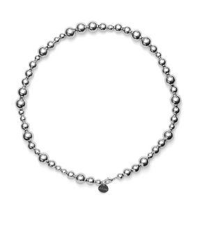 The LIÉ STUDIO Elly Necklace by Lie Studio features silver-plated brass beads with a circular pendant near the clasp.